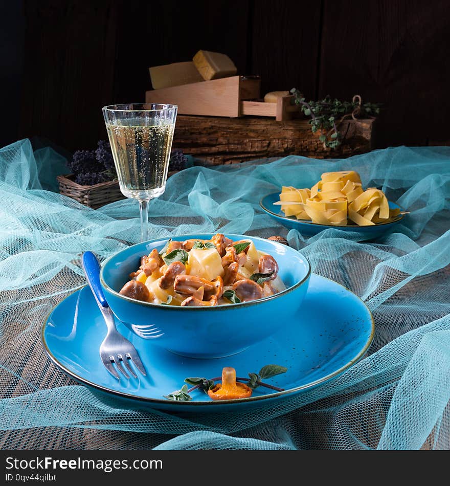 A pappardelle with cheese sauce and fresh chanterelles