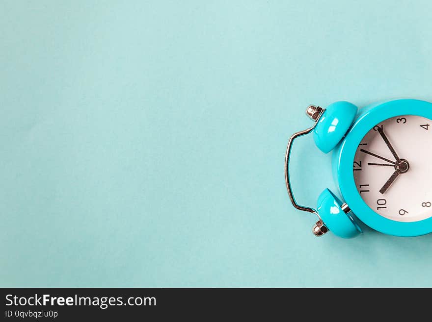 Ringing twin bell vintage classic alarm clock Isolated on blue pastel colorful trendy background. Rest hours time of life good