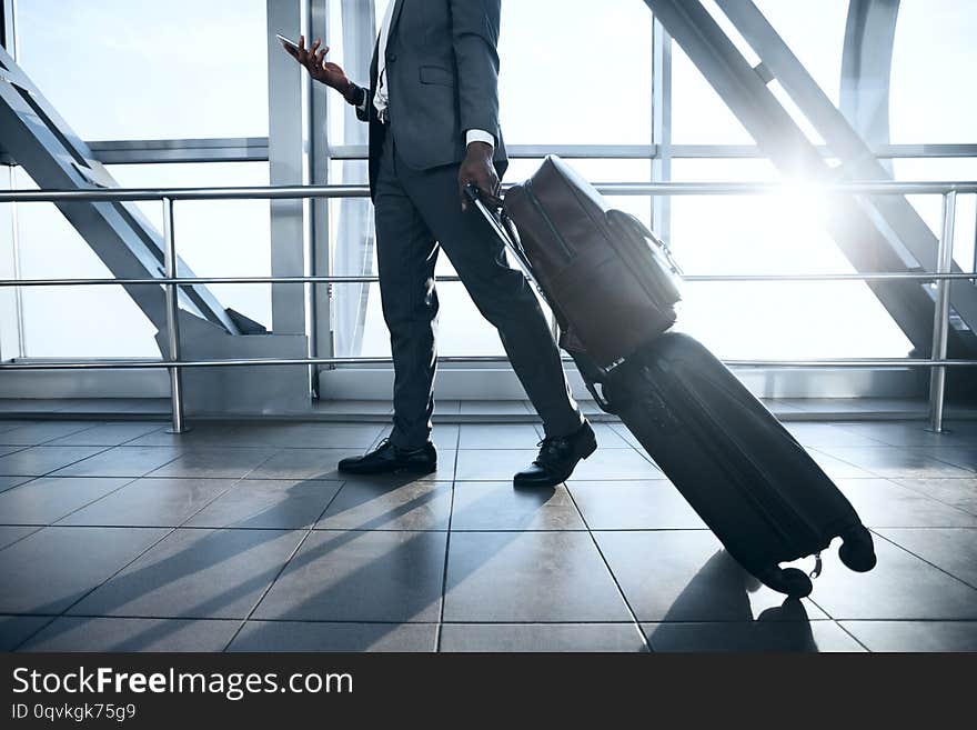 Business Trip. Businessman Moving to Terminal Gate at International Airport