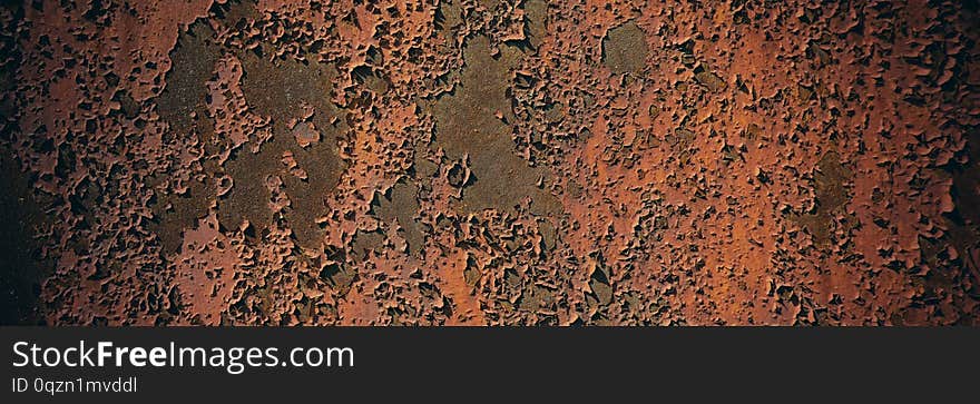 Rusty metal sheet surface coated with decaying paint. Web banner