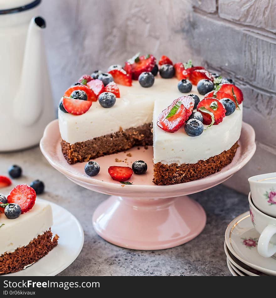 Sliced No Bake Ricotta and Gluten-Free Base Cheesecake with Fresh Berries, square. Sliced No Bake Ricotta and Gluten-Free Base Cheesecake with Fresh Berries, square