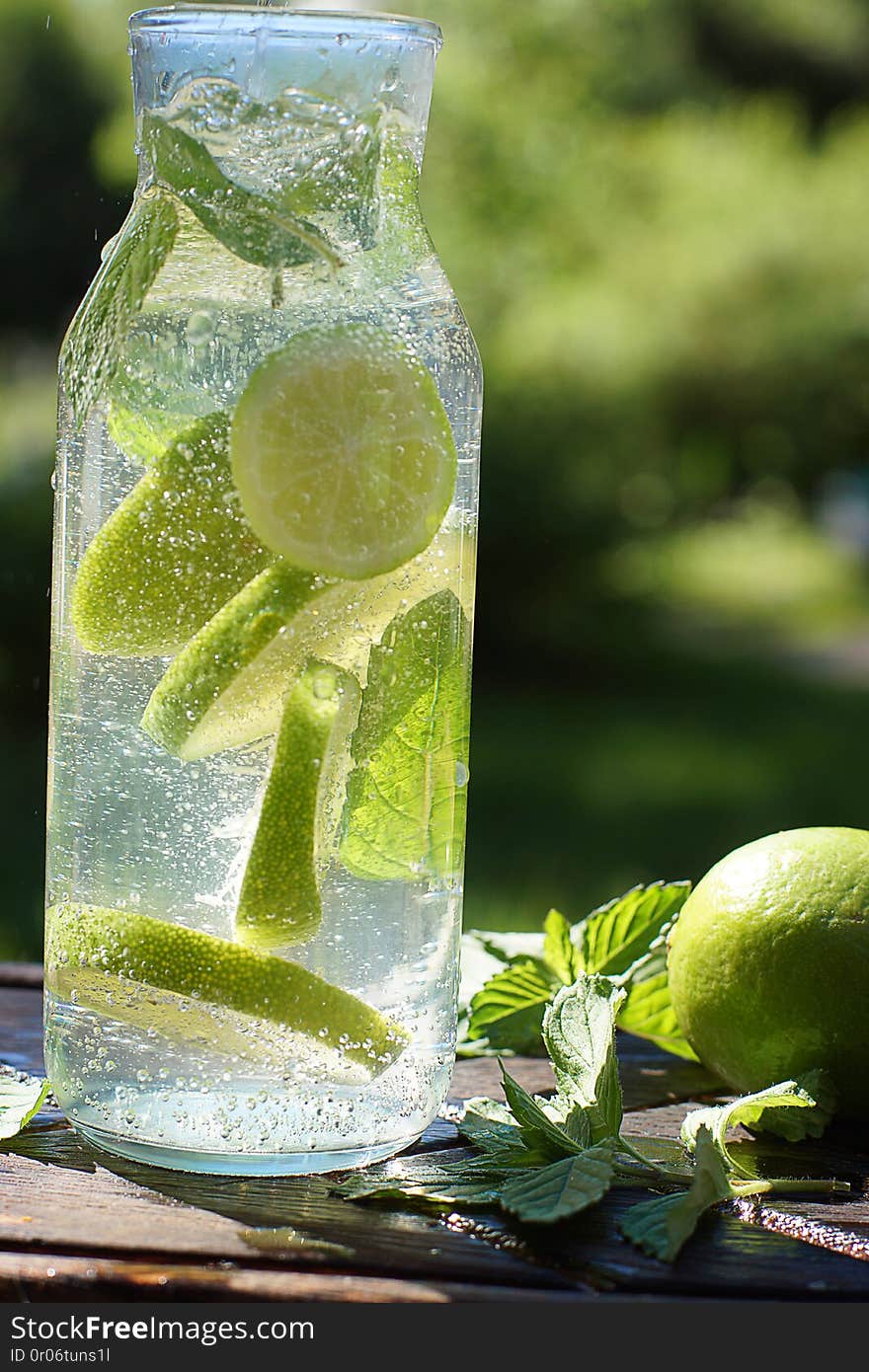 A whirl of mint and lime in a bottle with homemade mojito cocktail.