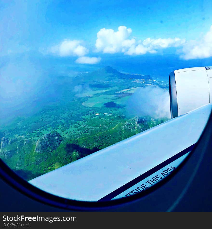 Beautiful landscape of Mauritius Island, mountains and sea, view from the plane. Beautiful landscape of Mauritius Island, mountains and sea, view from the plane.