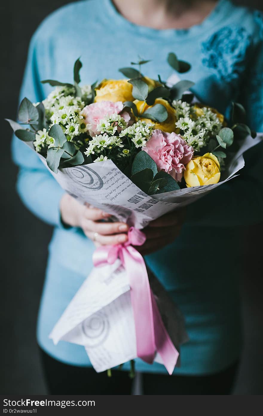 Beautiful bouquet of flowers in the hands of a woman.