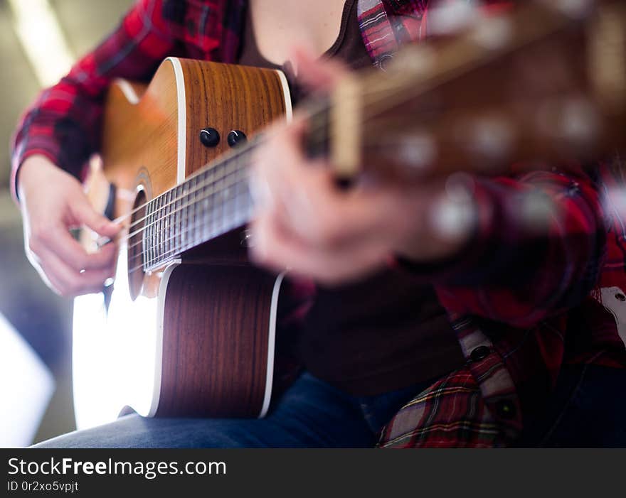 Close-up girl holding guitar