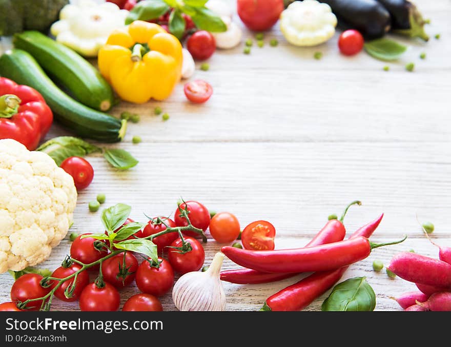 Different raw vegetables on a old wooden table