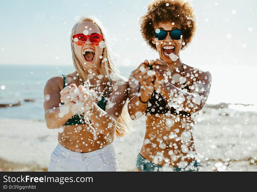 Best friends having fun on beach holiday