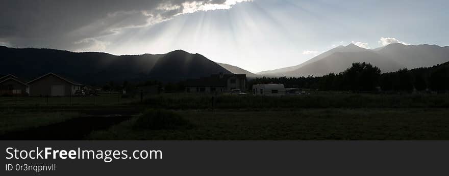 Sun rays beaming down on the San Francisco Peaks &#x28;right&#x29; and Mount Elden, Flagstaff, Arizona. This panorama was stitched using Microsoft ICE. Sun rays beaming down on the San Francisco Peaks &#x28;right&#x29; and Mount Elden, Flagstaff, Arizona. This panorama was stitched using Microsoft ICE.