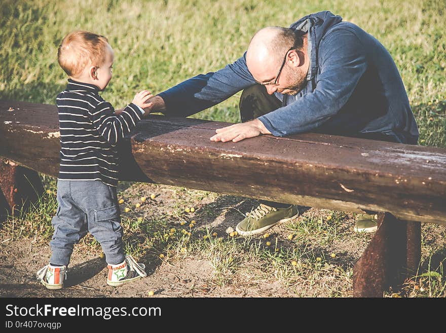 father playing with his son outdoors