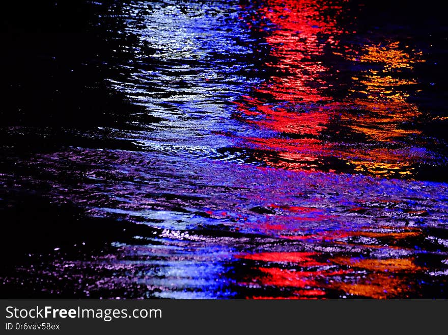 Blurred colorful light reflection on river surface