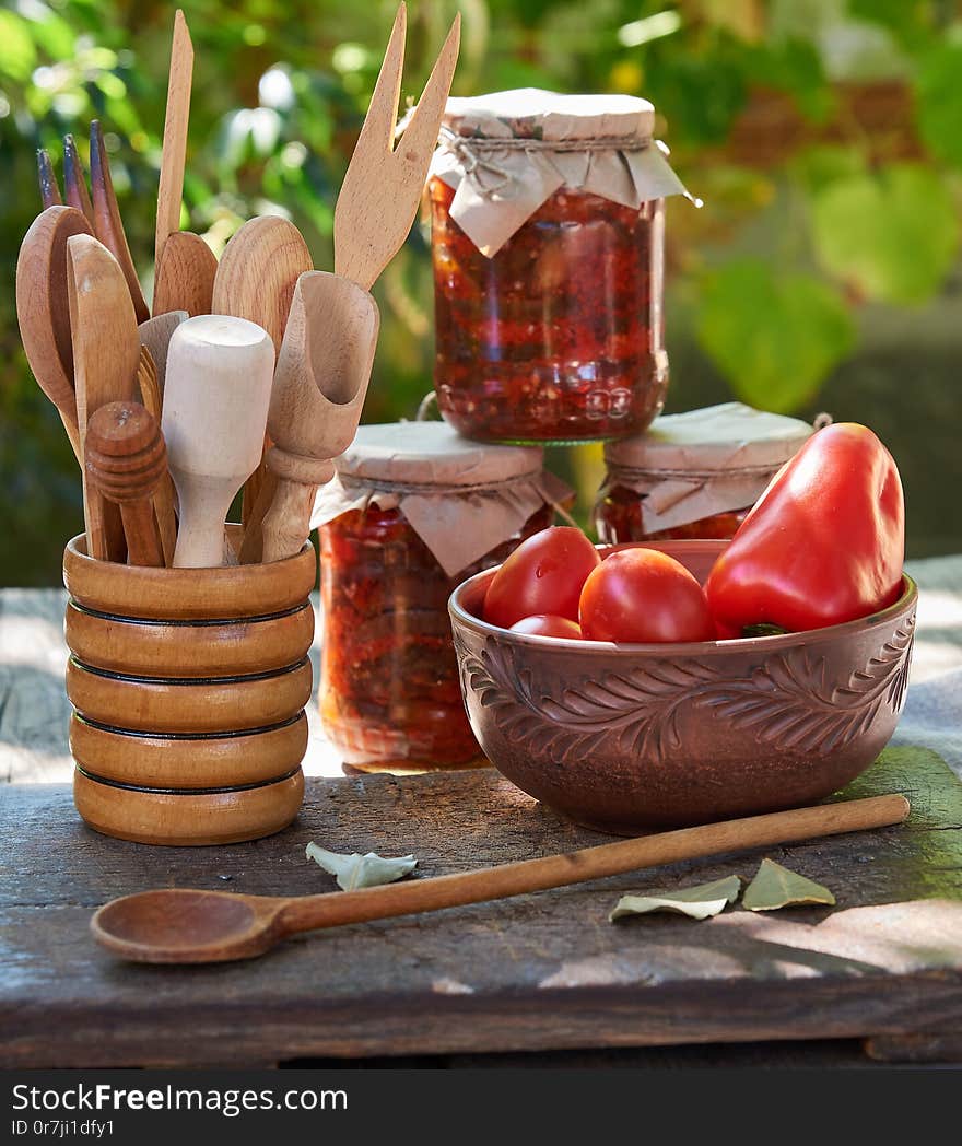 canned eggplant with vegetables on a brown wooden board