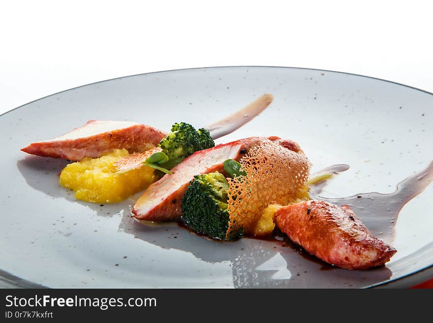 closeup sliced baked turkey against white background