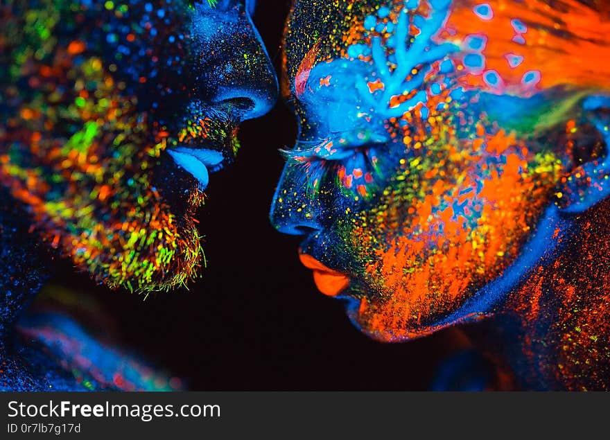 Portrait of a pair of lovers painted in fluorescent powder.