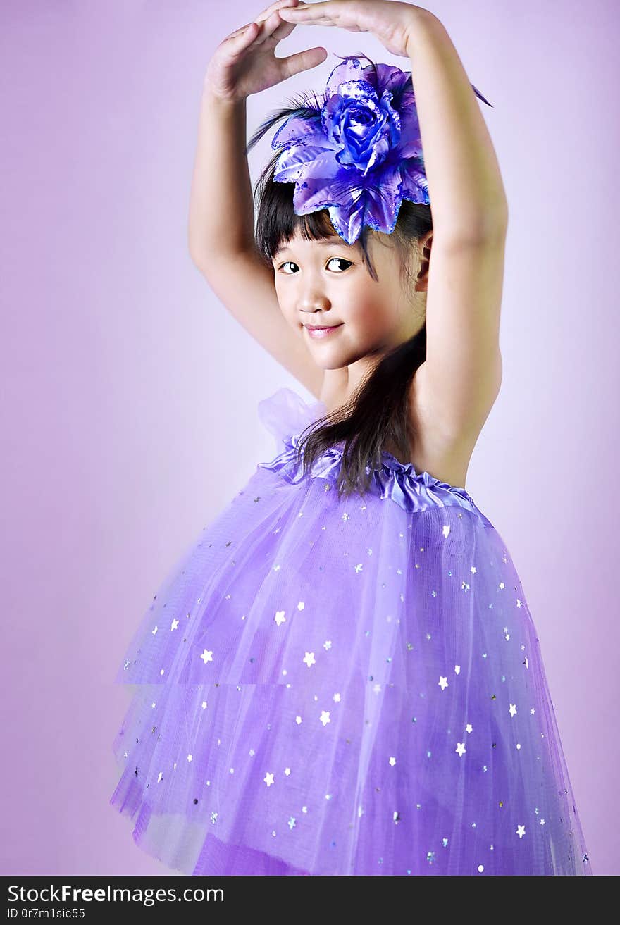 Portrait of asian little  girl in purple dress