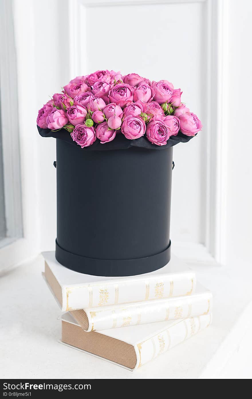 Beautiful Bouquet of flowers in a round hat box on a table