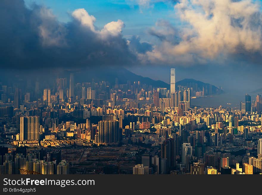 Aerial view of Hong Kong Downtown, Republic of China. Financial district and business centers in technology smart city in Asia. Top view of skyscraper and high-rise buildings at sunset