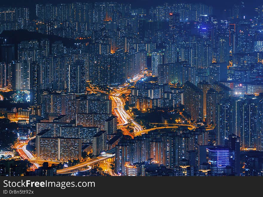 Aerial view of Hong Kong Downtown, Republic of China. Financial district and business centers in technology smart city in Asia. Top view of skyscraper and high-rise buildings at night