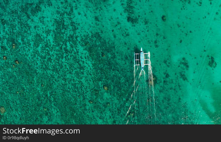 Wide tropical beach with white sand, view from above.