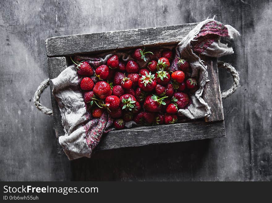 Fresh strawberries in the box on wooden vintage table, Healthy food, fruit a