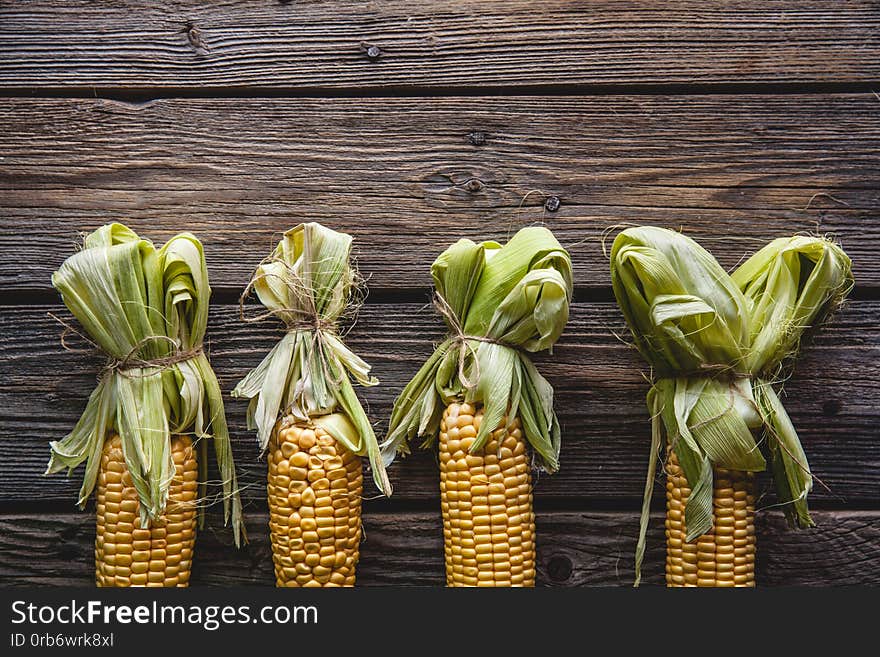 Fresh corn on wooden table a