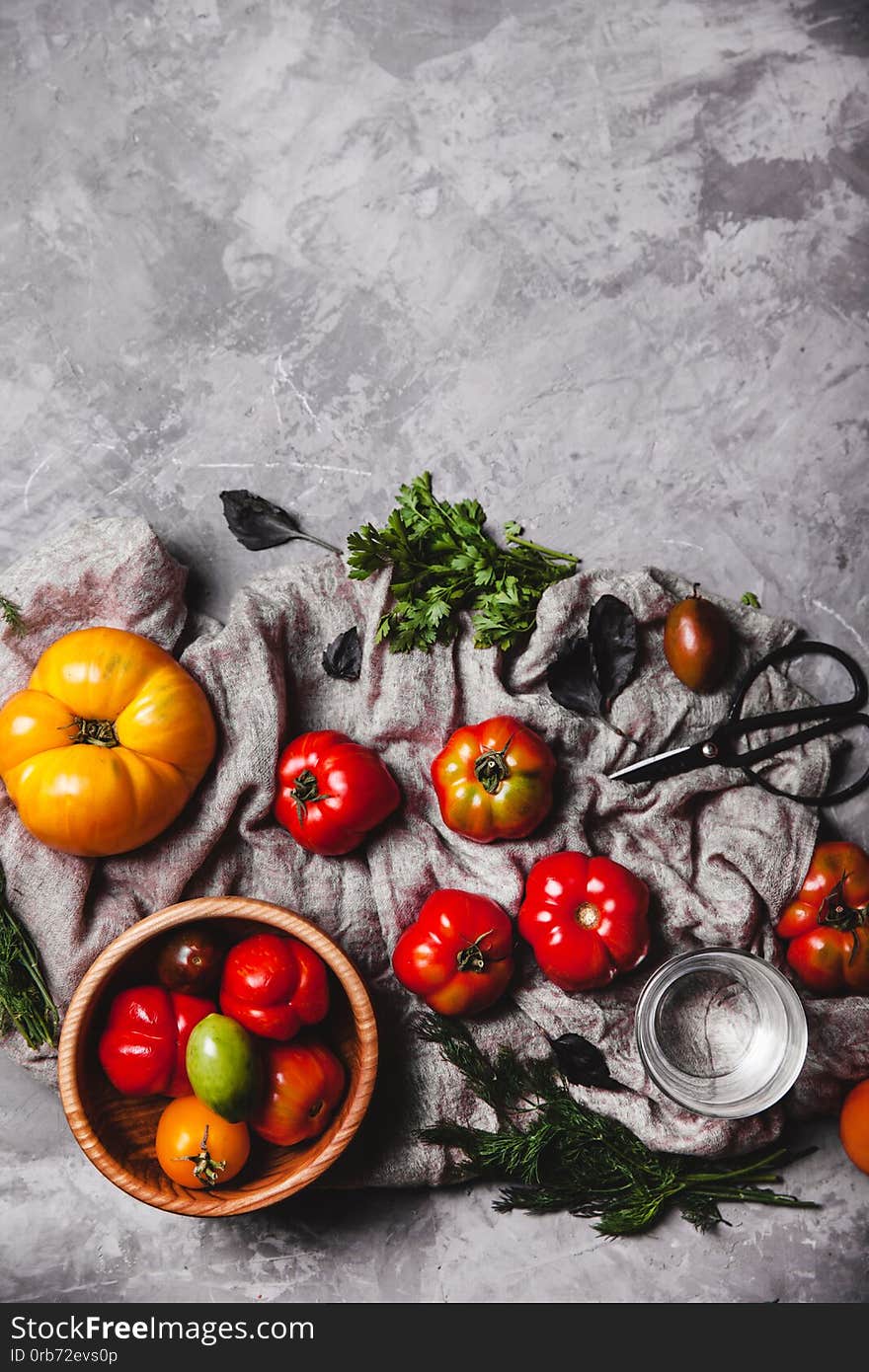 Fresh cherry tomatoes on wooden background