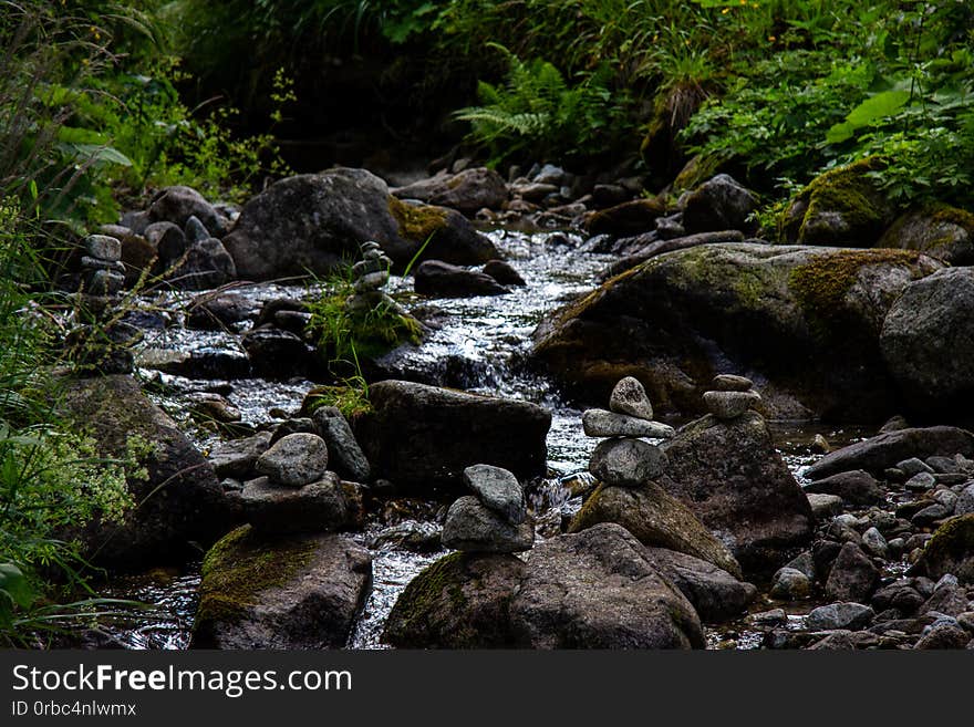 Stone Towers In A Stream