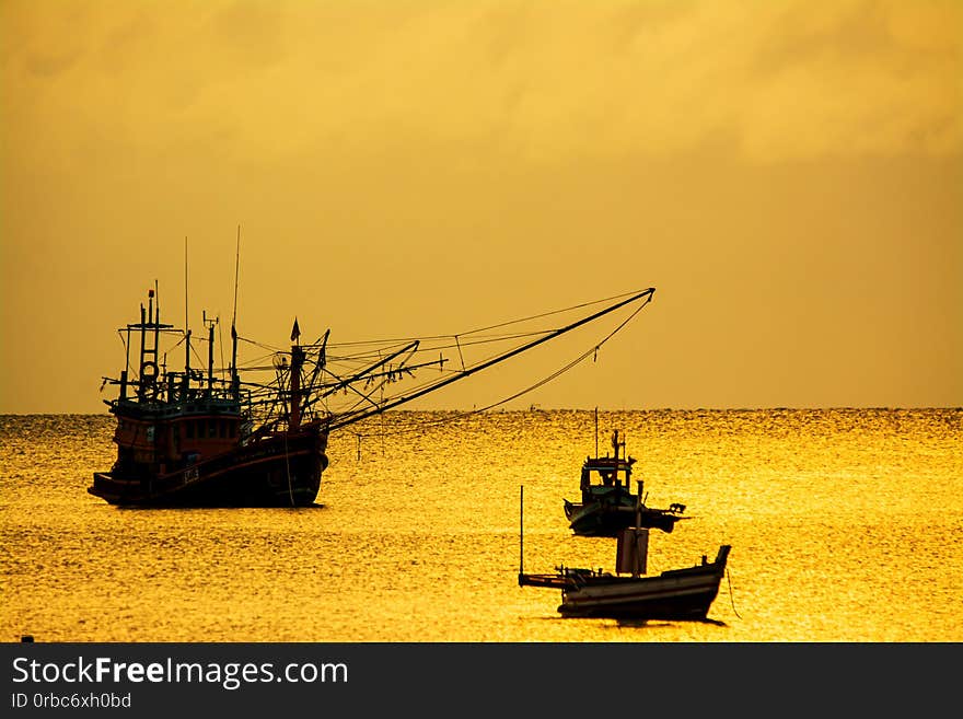 Small fishing boats in  the sea sea in Twilight time .