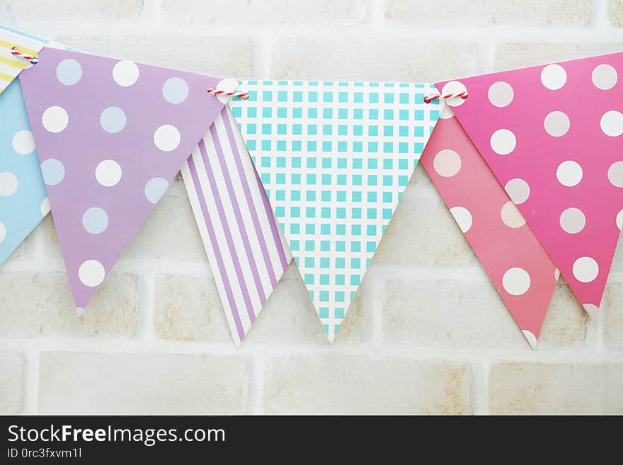 Colorful Bunting hanging with space copy on wooden background