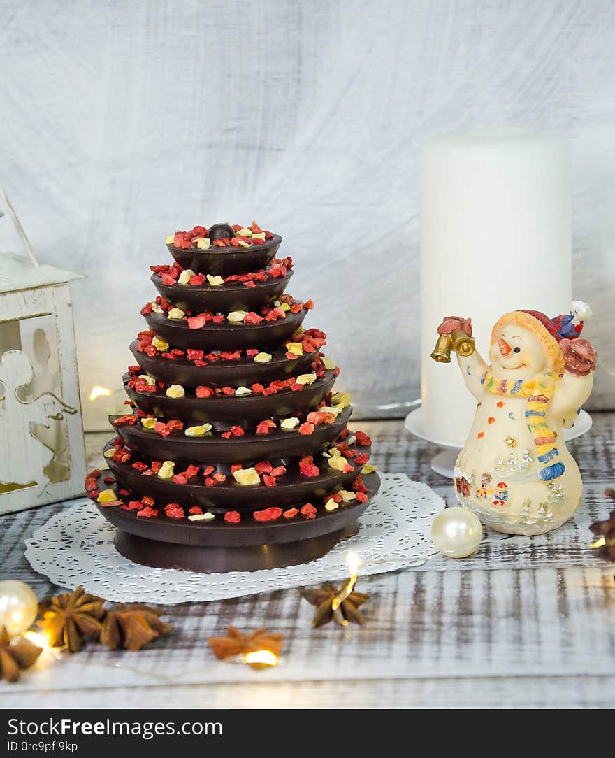 The Christmas decoration set with candles, lights and firtree