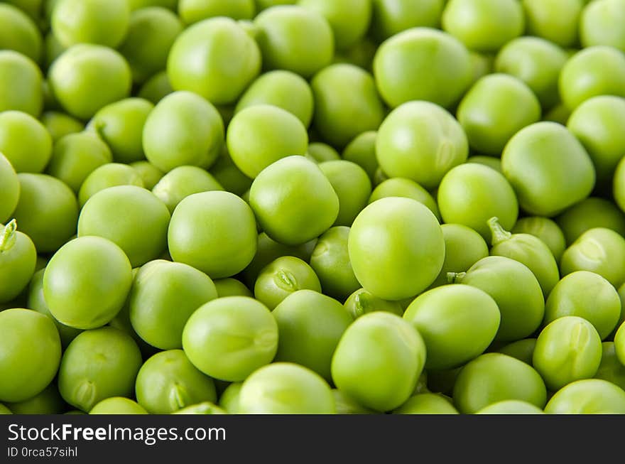 Fresh raw organic green pea background, vegetable pattern texture, selective focus,close up