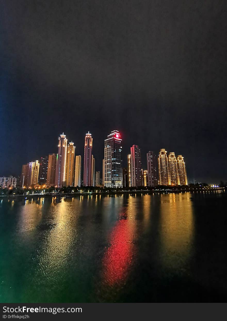 Night scenes of skyscrapers by the river wuhan city
