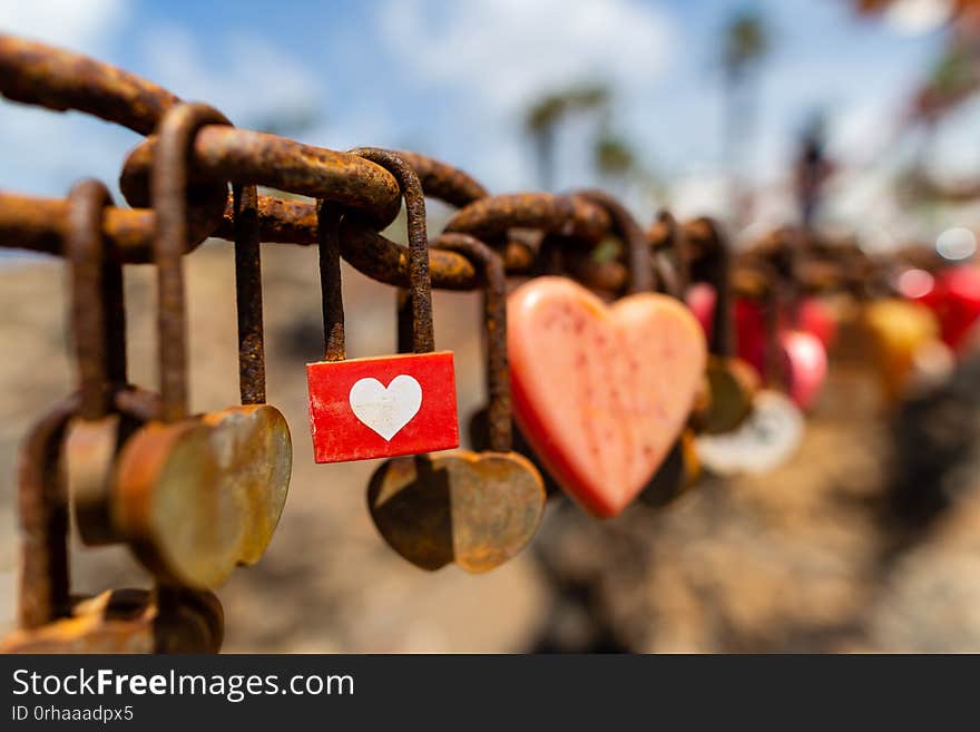 Puerto del Carmen beach in Lanzarote, Canary islands, Spain, heart shaped padlocks, blue sea. Puerto del Carmen beach in Lanzarote, Canary islands, Spain, heart shaped padlocks, blue sea