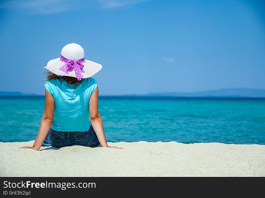 A happy girl at sea in greece on sand nature