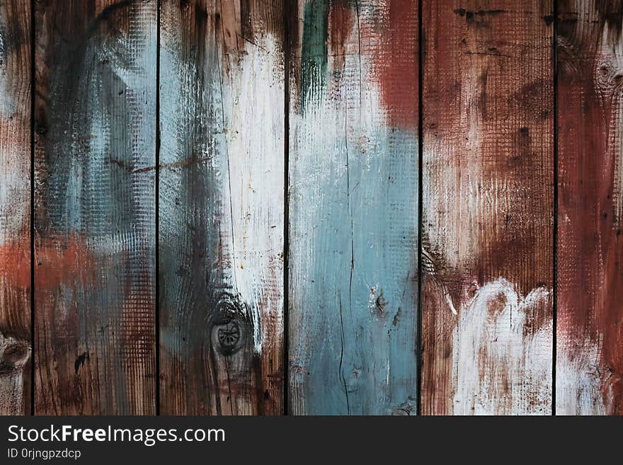 A rusty weathered grungy wood background or wallpaper with painted planks
