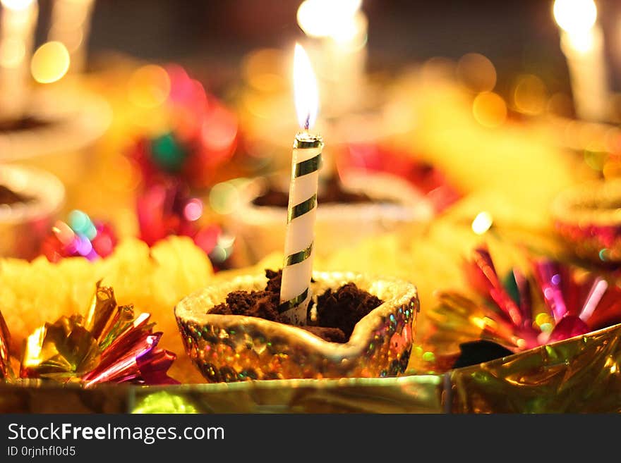 A Brightly lit Yellow Candle displayed at a Beautiful function of Mehndi in Peshawar city of Pakistan