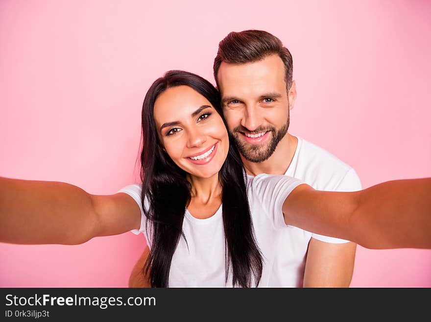 Photo of nice couple with men hugging, his beloved girlfriend from back while isolated with pastel background