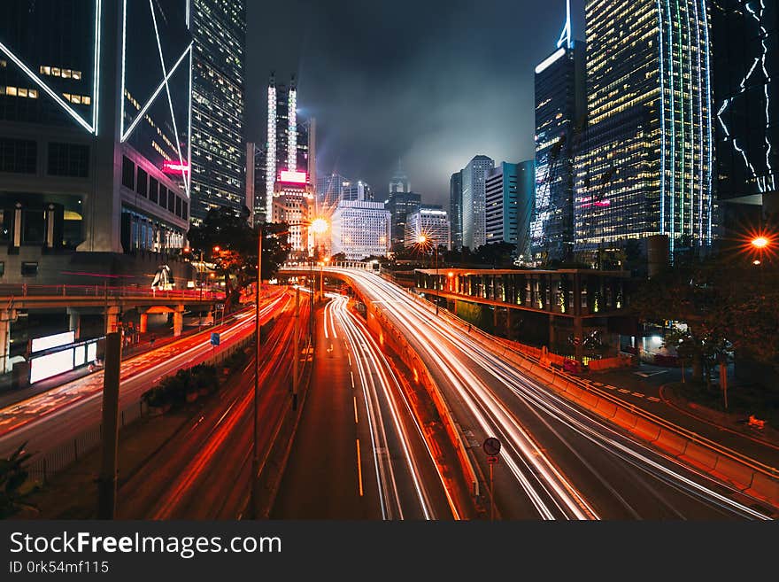 Street traffic at twilight sunset in Hong Kong. Office skyscraper buildings and with blurred car light trails. Hong Kong, Special