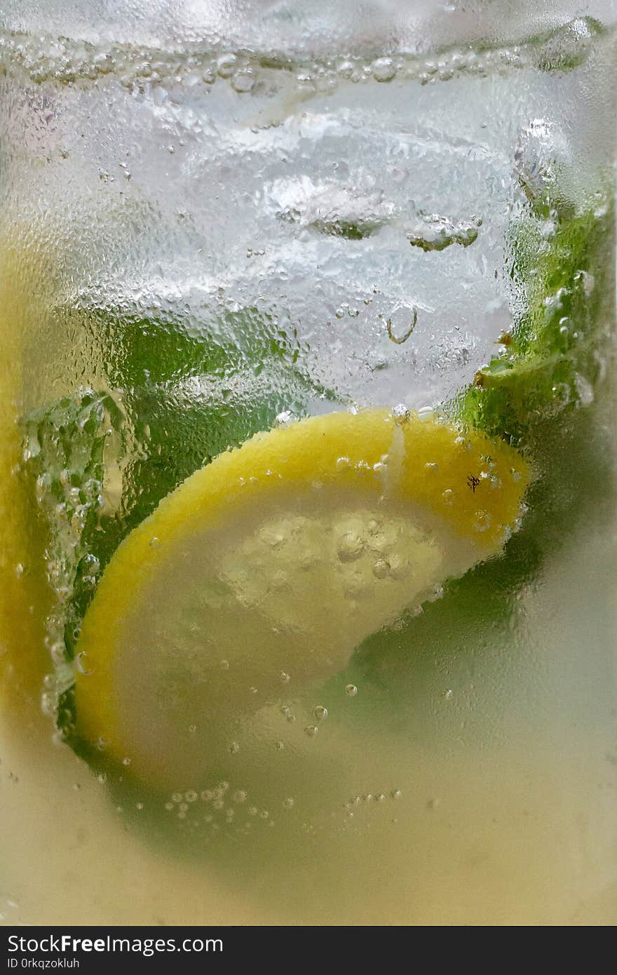 Close up of drinks with ice and lemon slice