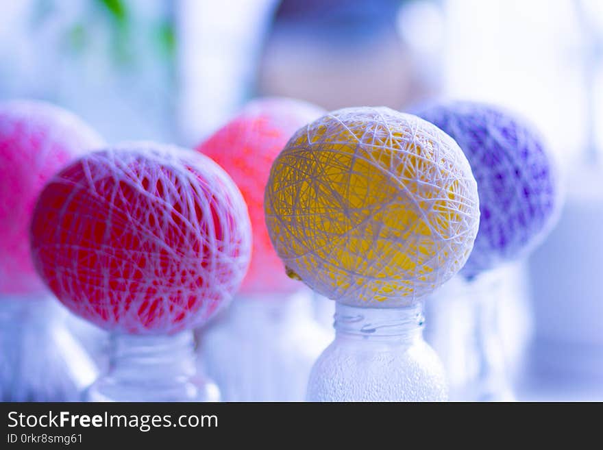 Multicolor balloons drying to become yarn decorative balls. Multicolor balloons drying to become yarn decorative balls