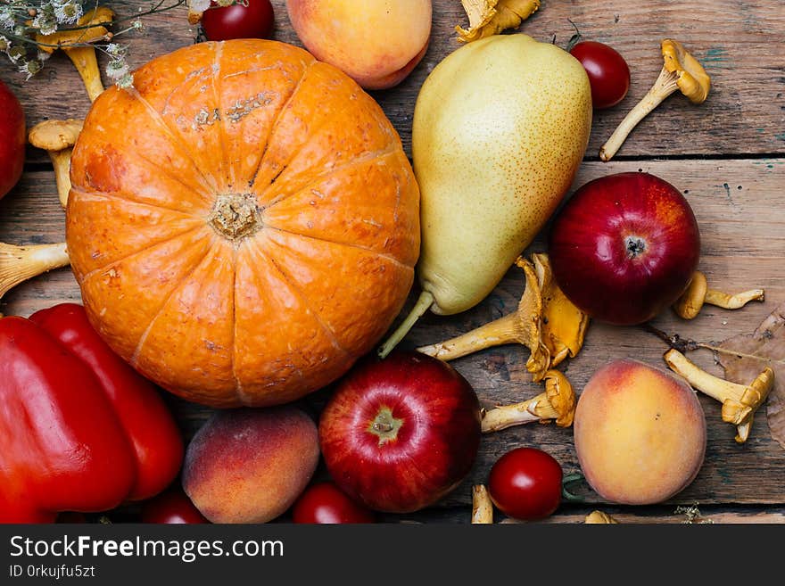 Autumn seasonal vegetables and fruits pumpkin, pear, apples, corn, chanterelles. Autumn products from the farm, or garden