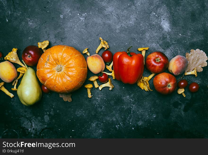 Autumn seasonal vegetables and fruits pumpkin, pear, apples, corn, chanterelles. Autumn products from the farm, or garden