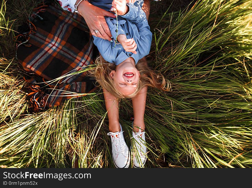 Mother and daughter hugging Beautiful summer nature. Space for text. Mother and daughter hugging Beautiful summer nature. Space for text.