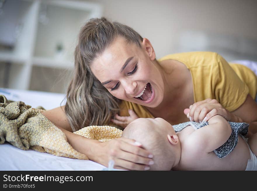 Did you know that you`re Mommy`s greatest treasure?  Mother and her baby boy at home