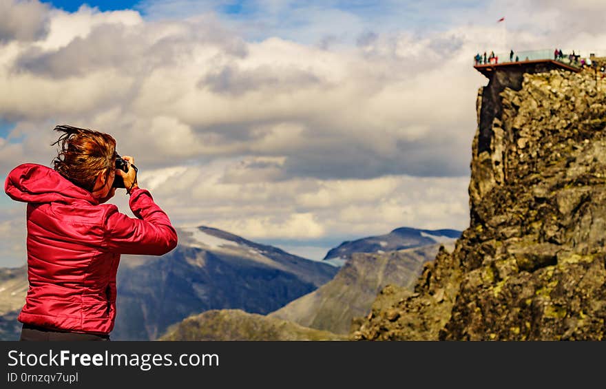 Tourist taking photo from Dalsnibba area Norway