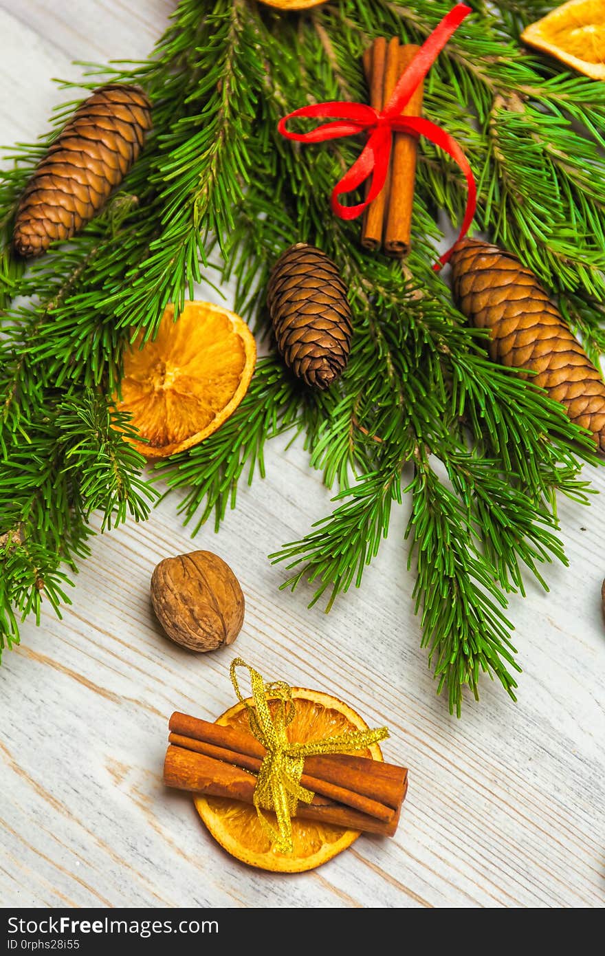 Christmas and New Year composition. Pine branches, cinnamon sticks, dried slices of orange and walnuts. Christmas and.