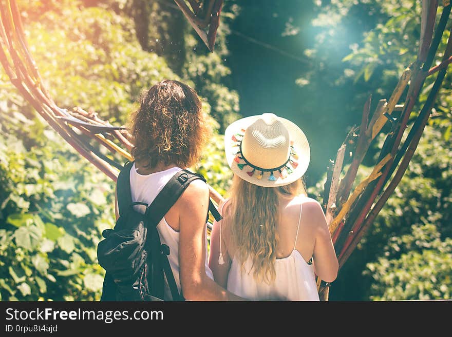 Couple of tourist in the jungle of Bali island