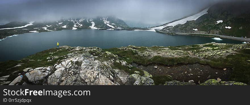 Young admiring the natural beauty of a glaciar lake