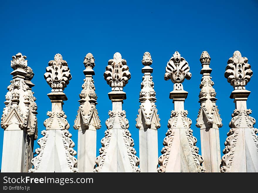 Spires and statues on the roof of Duomo Milan Cathedral, Italy.