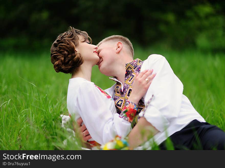 Portrait of affectionate couple with 
bouquet of flowers, adult, casual, modern, outdoor, passion, date, male, positive, romantic, caucasian, love, boyfriend, season, romance, sweetheart, girlfriend, beautiful, attractive, walk, female, lifestyle, fun, relationship, city, cheerful, woman, together, dating, person, white, joy, people, outside, happy, pretty, smile, handsome, flirting, two, beauty, happiness, green, grass, nature, ukraine