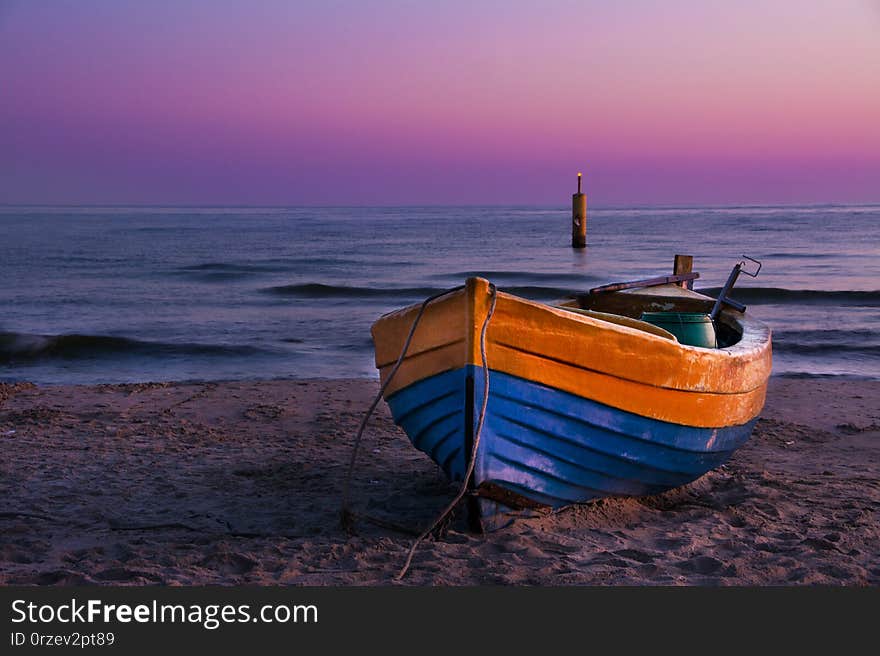 Fishing boat on the beach, beautiful sunrise. Poland